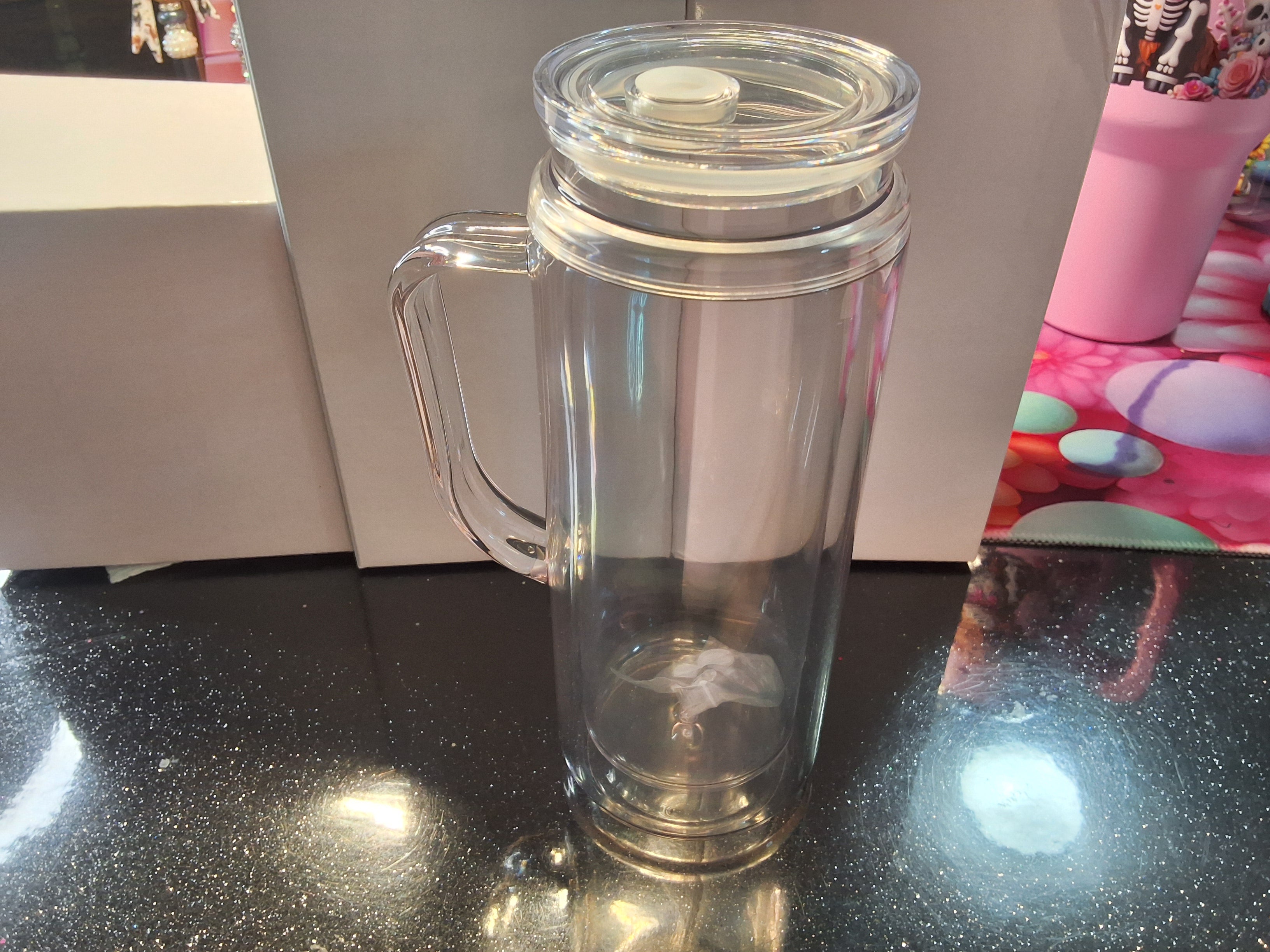 Acrylic snow globe tumbler with handle. 20oz